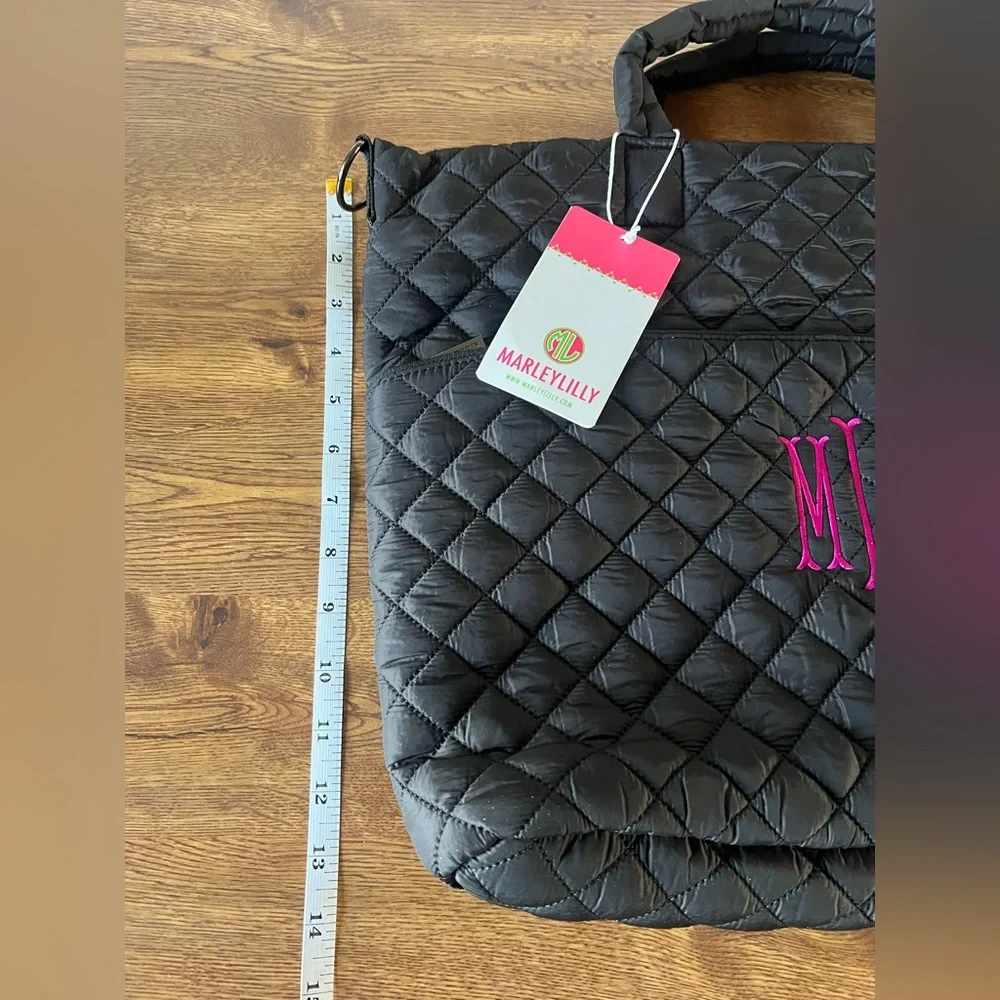 Marleylilly monogrammed black quilted laptop bag with the initials MML